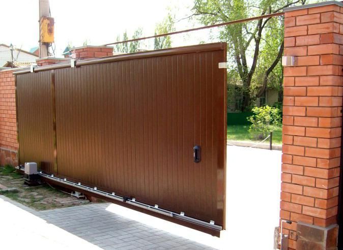 Відкотні ворота 5000х2500 заповнення сендвіч-панелями 720719288 фото